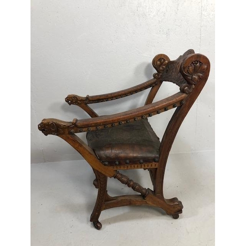 421 - Antique Furniture, 19th Century Spanish revival arm chair the frame with carved decoration of lions ... 