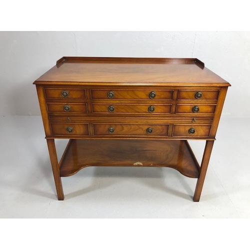 424 - Reproduction antique Mahogany sideboard with nine drawers and shelf under