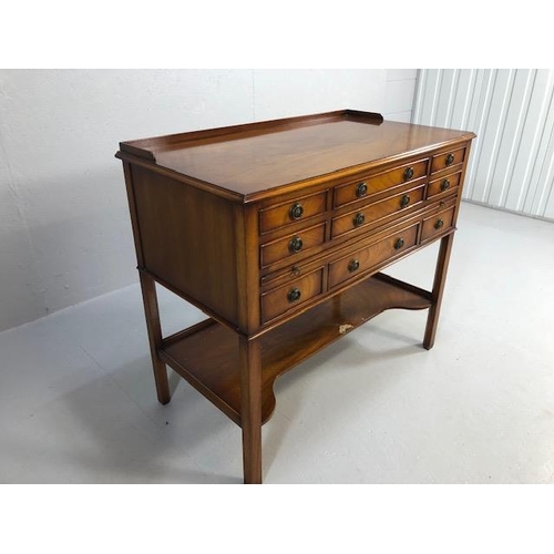 424 - Reproduction antique Mahogany sideboard with nine drawers and shelf under