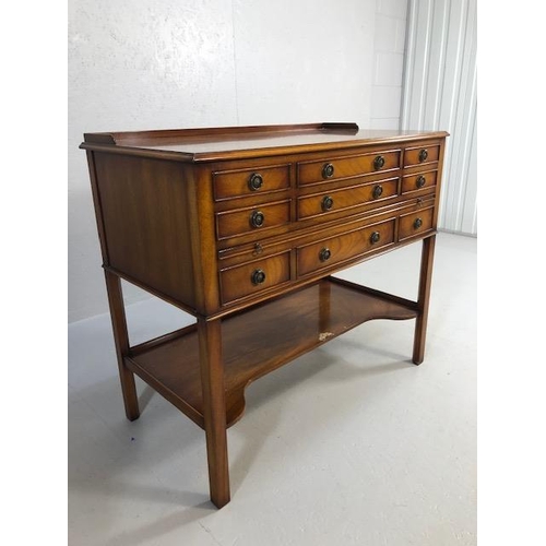 424 - Reproduction antique Mahogany sideboard with nine drawers and shelf under