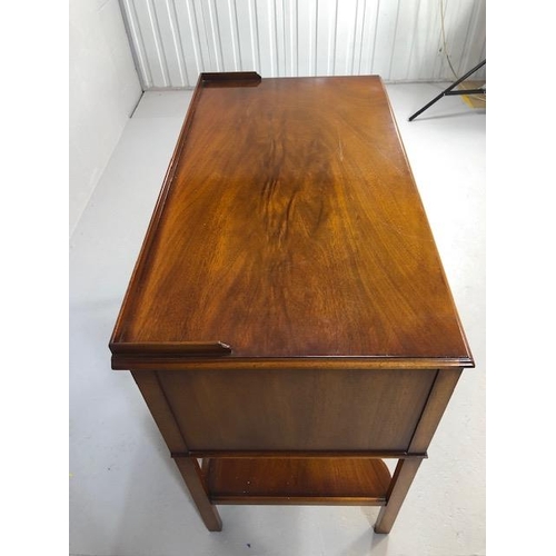 424 - Reproduction antique Mahogany sideboard with nine drawers and shelf under