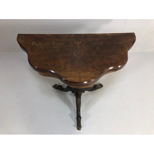 425 - Antique folding card table with book match veneer, on carved tripod base opening to reveal green bai... 