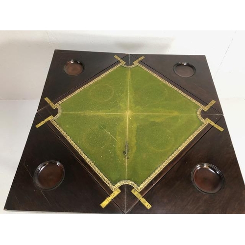 426 - Edwardian games table with inlay top, on serpentine legs, the four triangular quarters of the top hi... 