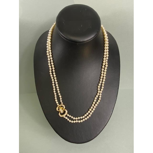 55 - cultured pearls with 18ct gold and Diamond clasp, double strand necklace of graduated cultured pearl... 