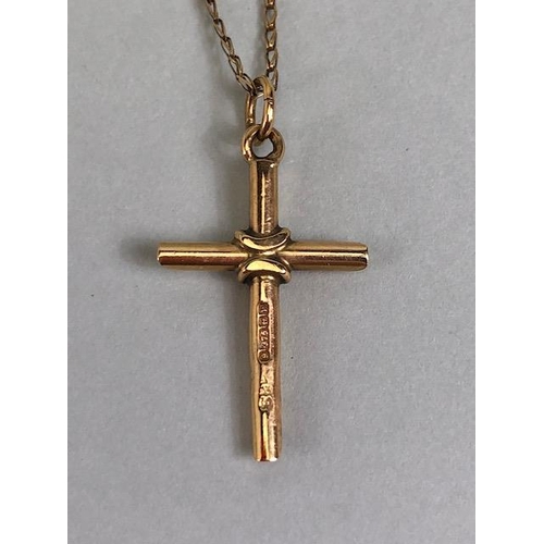 56 - Hallmarked 375 9ct Gold cross on fine 9ct Gold chain (A?F) total weight approx 3g