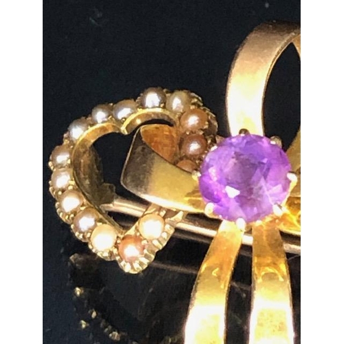 59 - 15ct yellow gold Victorian sweet heart brooch of 2 joined hearts set with seed peals and amethysts a... 