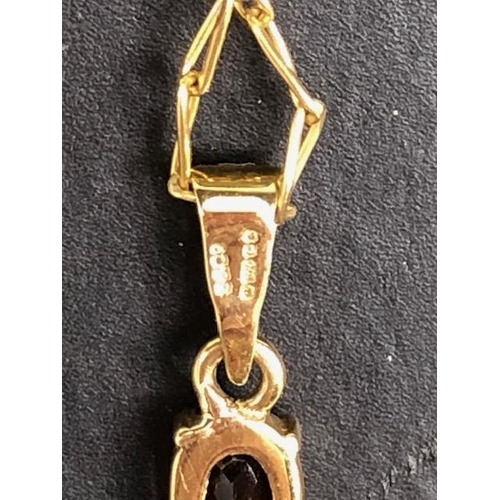 6 - 9ct Gold chain with a 9ct Gold pendant cross set with garnets (total weight approx 6.5g