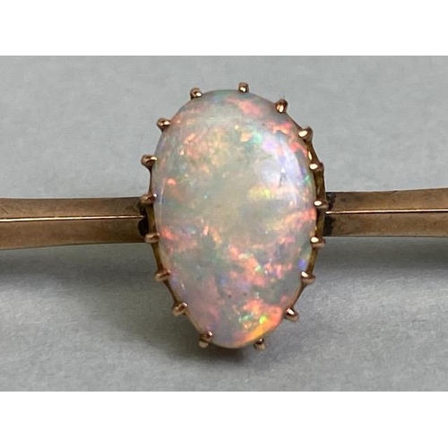 61 - Unmarked antique gold bar brooch set with a pear shaped opal approximately 5 x 10mm, total weight ap... 