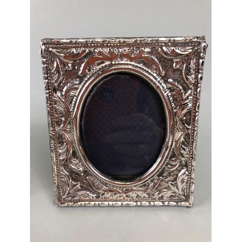 69 - Silver hallmarked photo frames, one round of art nouveau design 14cm across, (picture 10cm), one Obl... 