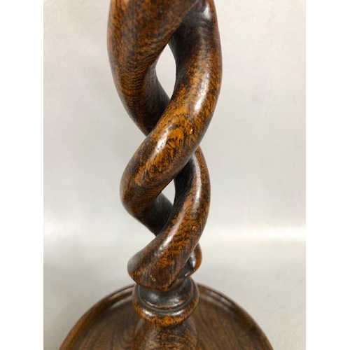 77 - Wooden twisted stem / open barley twist candle sticks with silver coloured metal mounts each approx ... 