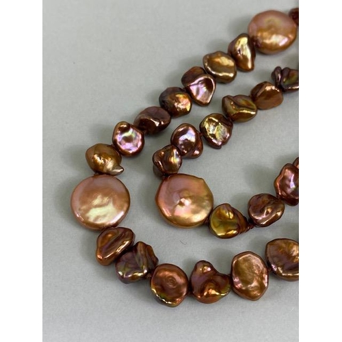 84 - Pearls, a string of bronze dyed baroque pearls with 14kt clasp approximately 36in