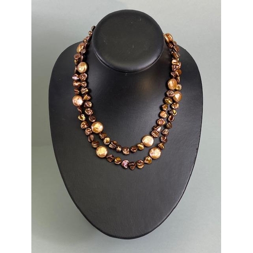 84 - Pearls, a string of bronze dyed baroque pearls with 14kt clasp approximately 36in