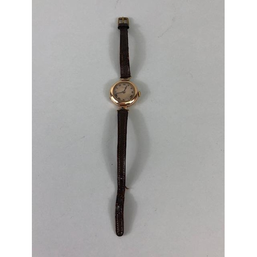 9 - 9ct Gold Ladies early 20th century round wrist watch on leather strap approximately 14.86g complete ... 