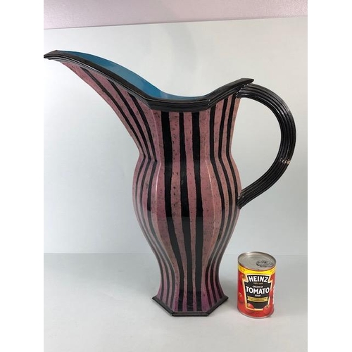 94 - Ross Emerson Art Ceramics, Oversized lilac and black stripped beak jug monogram to base approximatel... 