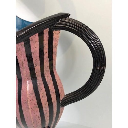 94 - Ross Emerson Art Ceramics, Oversized lilac and black stripped beak jug monogram to base approximatel... 