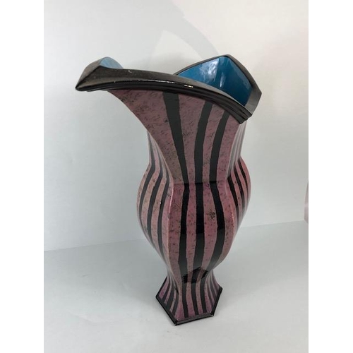 94 - Ross Emerson Art Ceramics, Oversized lilac and black stripped beak jug monogram to base approximatel... 