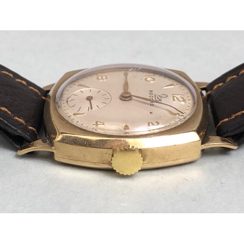 18a - 9ct Gold watch by RECORD square face with subsidiary dial at 6pm winds runs and sets on leather stra... 