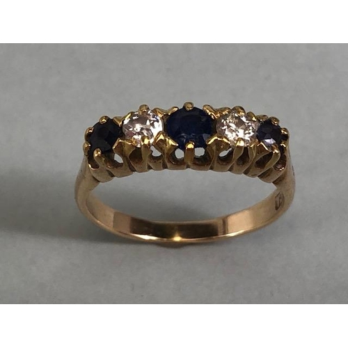 10 - 15ct marked yellow gold ring set with 3 sapphires and 2 diamonds, approximately size K  and 2.7g