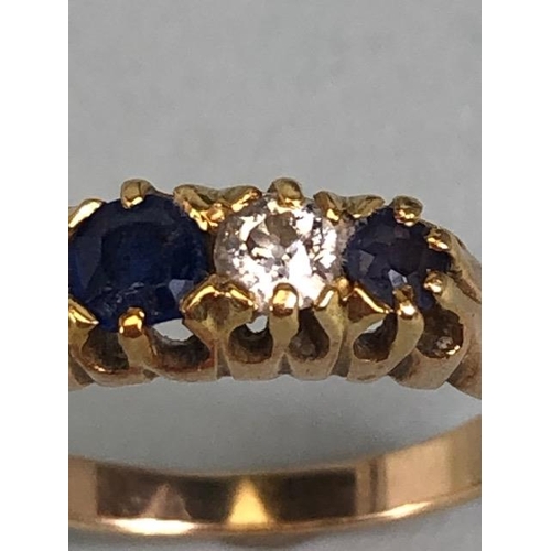 10 - 15ct marked yellow gold ring set with 3 sapphires and 2 diamonds, approximately size K  and 2.7g