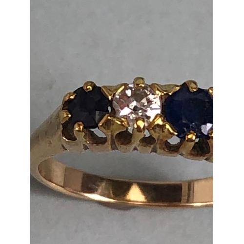 10 - 15ct marked yellow gold ring set with 3 sapphires and 2 diamonds, approximately size K  and 2.7g