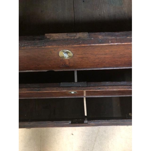 100 - Antique Georgian Oak Bureau with four drawers and fall front opening to pigeon holes and small drawe... 