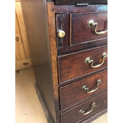 100 - Antique Georgian Oak Bureau with four drawers and fall front opening to pigeon holes and small drawe... 