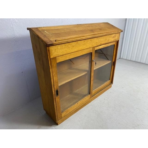 105 - Museum style bookcase with sliding glass fronted cupboards and single shelf with bureau style readin... 