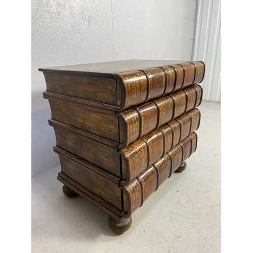 106 - Chest of four drawers of faux oversized books, wooden construction with gold inlay detailing on bun ... 