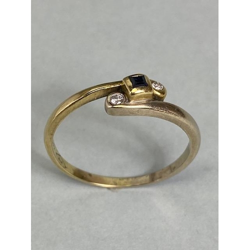 11 - 14ct Gold cross over ring set with diamonds size approx Q and 2.3g