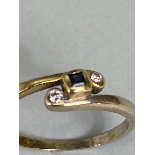 11 - 14ct Gold cross over ring set with diamonds size approx Q and 2.3g