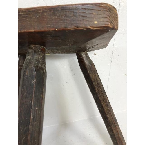 111 - Rustic oak jointed three legged stool of tall proportions approx 58cm tall