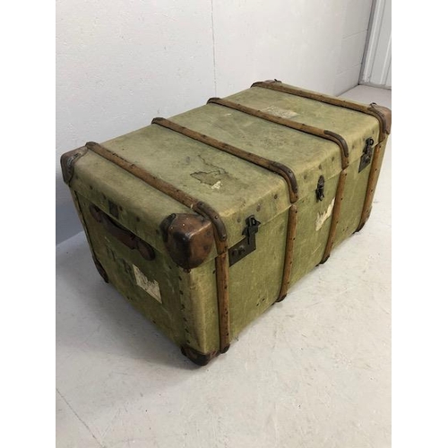 112 - Wooden bound green canvas travel trunk with leather corners approx 90 x 56 x 48cm