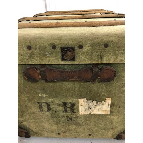 112 - Wooden bound green canvas travel trunk with leather corners approx 90 x 56 x 48cm