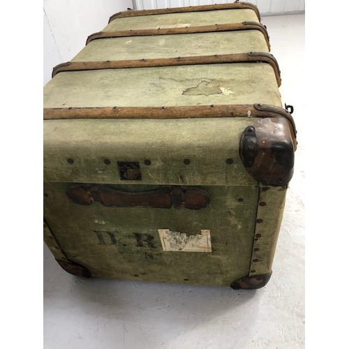 112 - Wooden bound green canvas travel trunk with leather corners approx 90 x 56 x 48cm