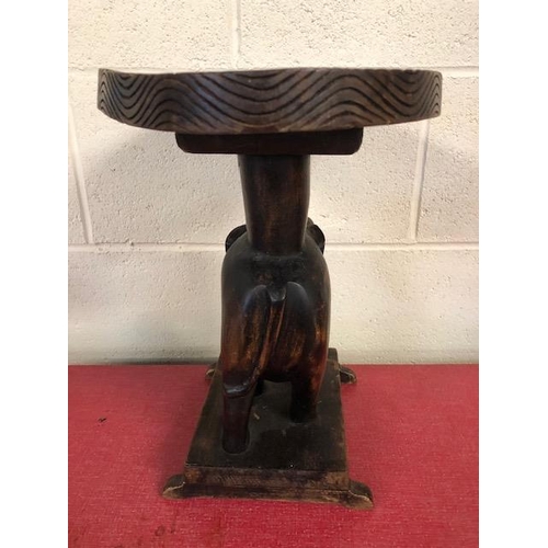 138 - Carved wooden elephant stool approximately 37cm high,  tribal style glass plate and a carved African... 