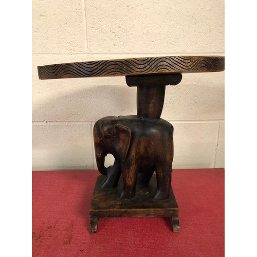 138 - Carved wooden elephant stool approximately 37cm high,  tribal style glass plate and a carved African... 