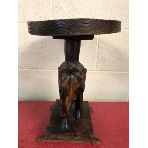 138 - Carved wooden elephant stool approximately 37cm high,  tribal style glass plate and a carved African... 