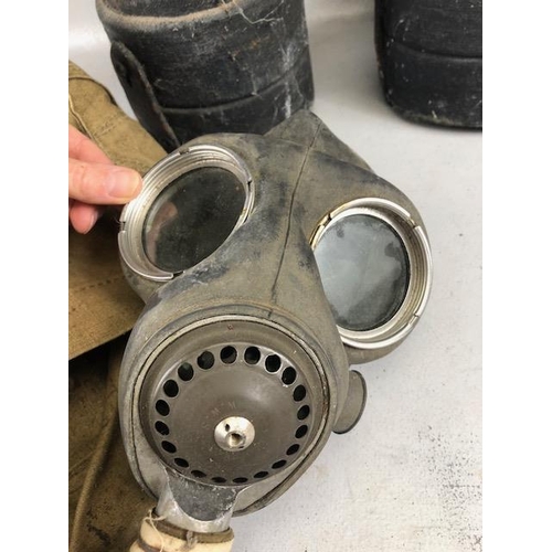 148 - Military interest, WW2 military gas mask, pair of goggles and 2 shell case covers painted with royal... 