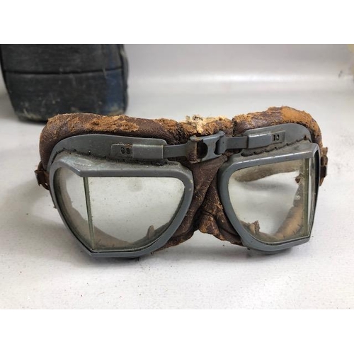 148 - Military interest, WW2 military gas mask, pair of goggles and 2 shell case covers painted with royal... 