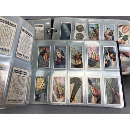 162 - Collection of Cigarette and Tea cards contained in 4 albums, to include, John Player , Wills Ltd, Br... 