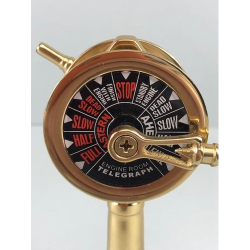 167 - Ships style clock with quartz movement mounted on a wooden plaque along with a desk model of a ships... 