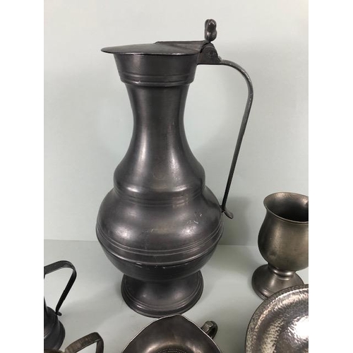 169 - Antique and vintage pewter ware to include a large ale or beer jug, spoons dishes, small jugs etc 13... 