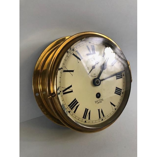 172 - Ships clock, Smiths Empire, round brass case, dial with Roman numerals and inset secondary dial, com... 