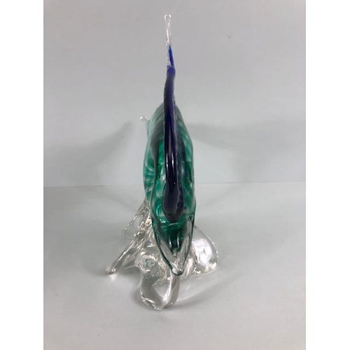 187 - Art glass, Murano glass fish on stylised swirling water in blue and sea green approximately 27cm hig... 