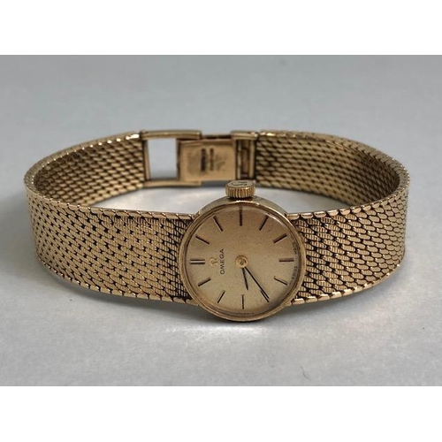 2 - OMEGA Wristwatch: 9ct Gold Omega, round faced, Gold dial with baton markers and 9ct Gold strap, tota... 