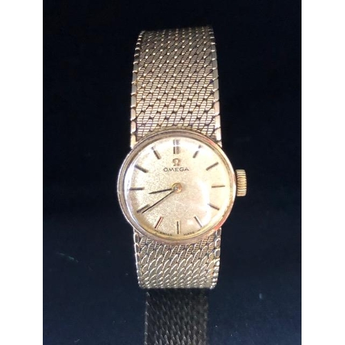 2 - OMEGA Wristwatch: 9ct Gold Omega, round faced, Gold dial with baton markers and 9ct Gold strap, tota... 