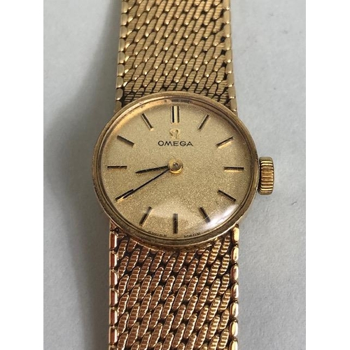 2 - OMEGA Wristwatch: 9ct Gold Omega, round faced, Gold dial with baton markers and 9ct Gold strap, tota... 