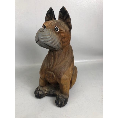 204 - Novelty dogs, one of metal approximately 15ch high  the other carved wood approximately 39cm high