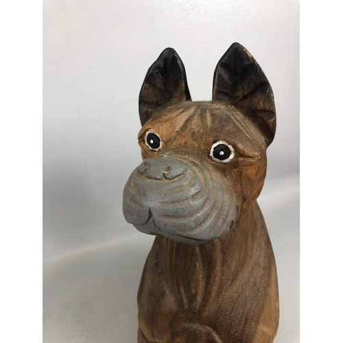 204 - Novelty dogs, one of metal approximately 15ch high  the other carved wood approximately 39cm high