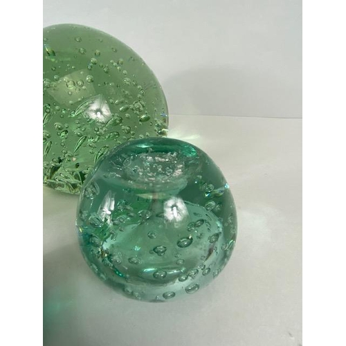 209 - Antique Victorian dump glass (bottle glass) , four round paper weights, with rain drop pattern, one ... 